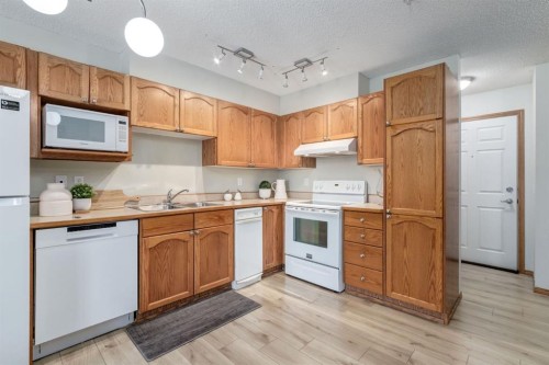 101-11 Somervale View Sw, Calgary, AB - Indoor Photo Showing Kitchen With Double Sink