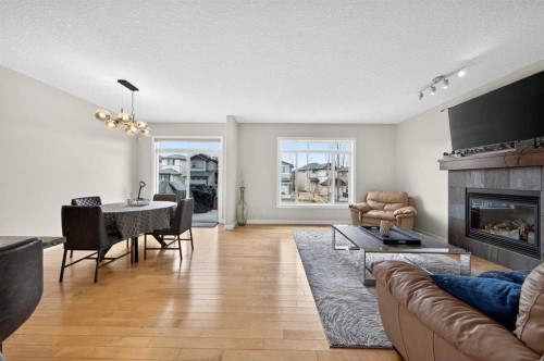 64 Panton Link Nw, Calgary, AB - Indoor Photo Showing Living Room With Fireplace