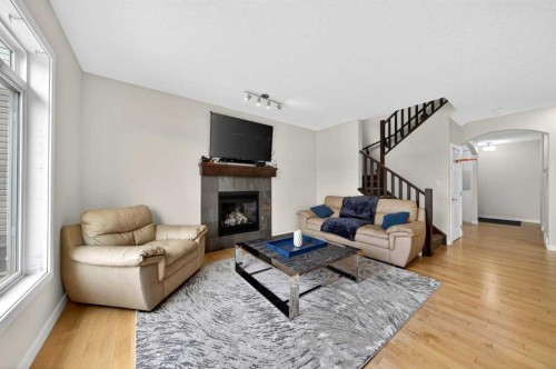 64 Panton Link Nw, Calgary, AB - Indoor Photo Showing Living Room With Fireplace