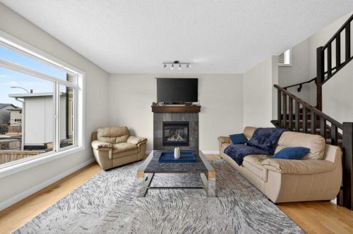64 Panton Link Nw, Calgary, AB - Indoor Photo Showing Living Room With Fireplace