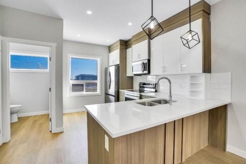 304 Red Sky Villas Ne, Calgary, AB - Indoor Photo Showing Kitchen With Stainless Steel Kitchen With Double Sink With Upgraded Kitchen