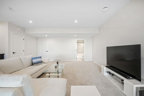 66 Savoy Landing Se, Calgary, AB - Indoor Photo Showing Living Room