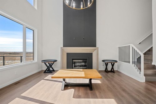 66 Savoy Landing Se, Calgary, AB - Indoor Photo Showing Living Room With Fireplace
