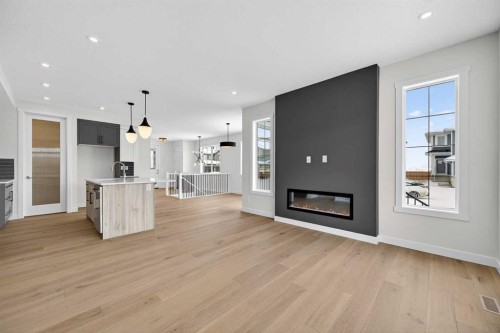 277 Waterford Way, Chestermere, AB - Indoor Photo Showing Living Room With Fireplace