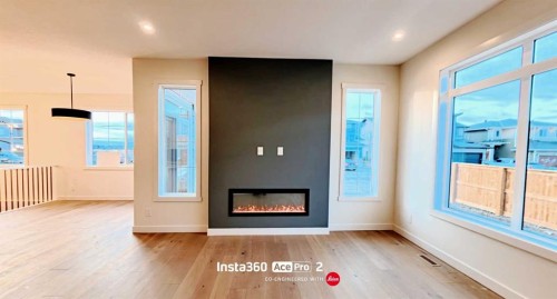277 Waterford Way, Chestermere, AB - Indoor Photo Showing Living Room With Fireplace