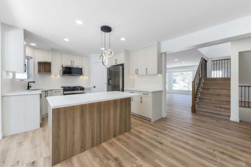 307 Hamptons Mews Nw, Calgary, AB - Indoor Photo Showing Kitchen With Upgraded Kitchen