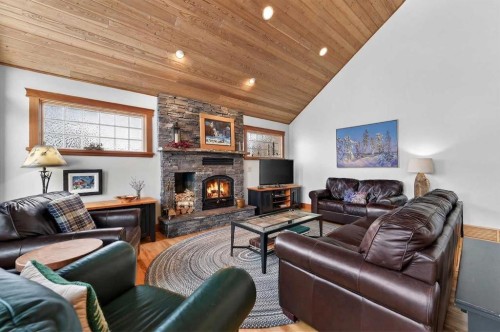 997 Wilson Way, Canmore, AB - Indoor Photo Showing Living Room With Fireplace