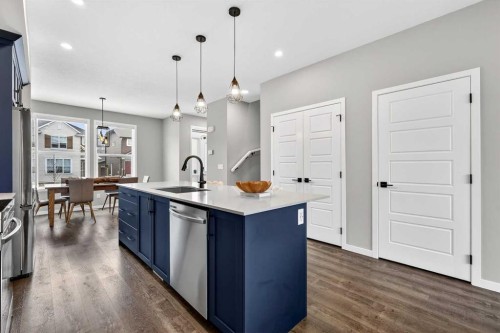 94 Wolf Gate Nw, Okotoks, AB - Indoor Photo Showing Kitchen With Upgraded Kitchen