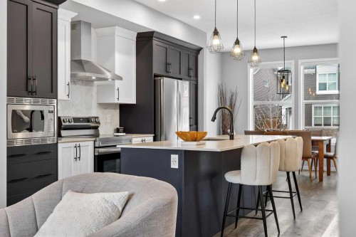94 Wolf Gate Nw, Okotoks, AB - Indoor Photo Showing Kitchen With Stainless Steel Kitchen With Upgraded Kitchen