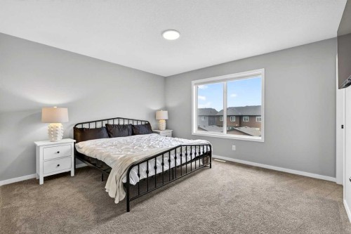 94 Wolf Gate Nw, Okotoks, AB - Indoor Photo Showing Bedroom