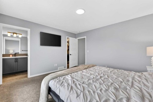 94 Wolf Gate Nw, Okotoks, AB - Indoor Photo Showing Bedroom