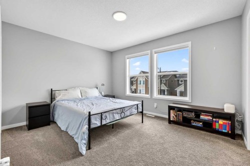 94 Wolf Gate Nw, Okotoks, AB - Indoor Photo Showing Bedroom