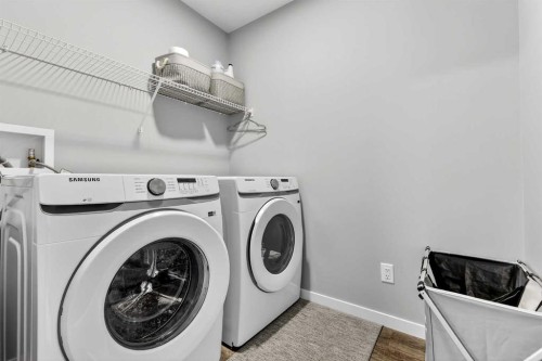 94 Wolf Gate Nw, Okotoks, AB - Indoor Photo Showing Laundry Room