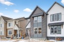 94 Wolf Gate Nw, Okotoks, AB  - Outdoor With Facade 