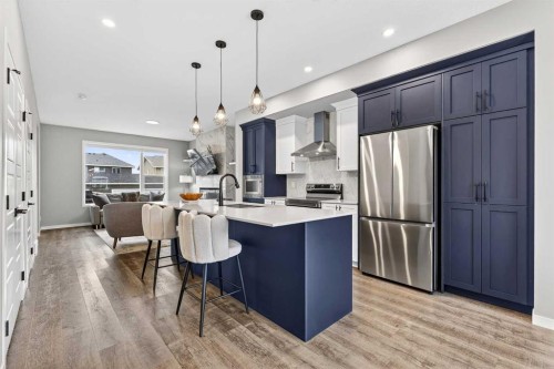 94 Wolf Gate Nw, Okotoks, AB - Indoor Photo Showing Kitchen With Stainless Steel Kitchen With Upgraded Kitchen