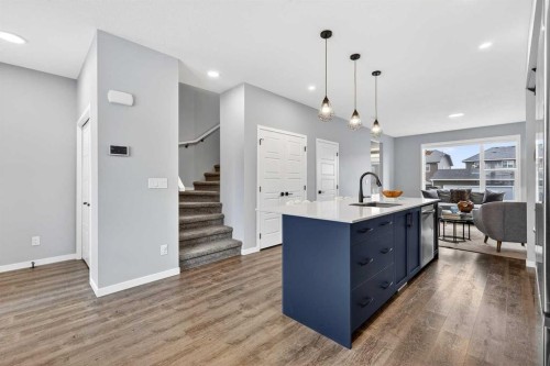94 Wolf Gate Nw, Okotoks, AB - Indoor Photo Showing Kitchen With Upgraded Kitchen