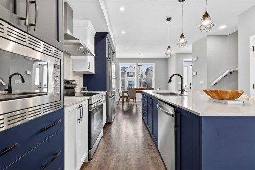 94 Wolf Gate Nw, Okotoks, AB - Indoor Photo Showing Kitchen With Stainless Steel Kitchen With Upgraded Kitchen