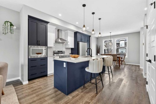 94 Wolf Gate Nw, Okotoks, AB - Indoor Photo Showing Kitchen With Upgraded Kitchen