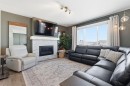 459 Rivercrest Road, Cochrane, AB  - Indoor Photo Showing Living Room With Fireplace 