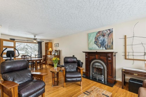 2363 23 Street Nw, Calgary, AB - Indoor Photo Showing Living Room With Fireplace