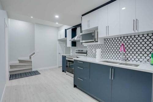 673 Corner Meadows Way Ne, Calgary, AB - Indoor Photo Showing Kitchen With Double Sink