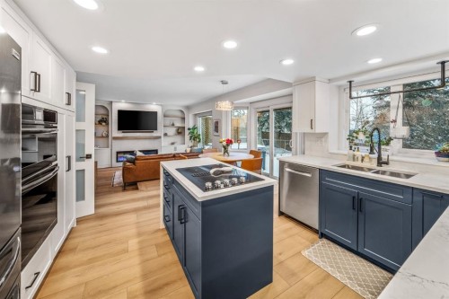 76 Stradbrooke Way Sw, Calgary, AB - Indoor Photo Showing Kitchen With Double Sink With Upgraded Kitchen