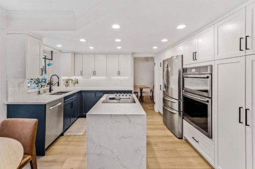 76 Stradbrooke Way Sw, Calgary, AB - Indoor Photo Showing Kitchen With Double Sink