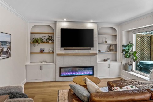 76 Stradbrooke Way Sw, Calgary, AB - Indoor Photo Showing Living Room With Fireplace