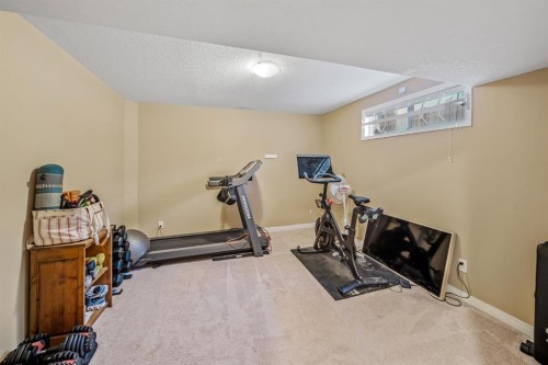 76 Stradbrooke Way Sw, Calgary, AB - Indoor Photo Showing Gym Room
