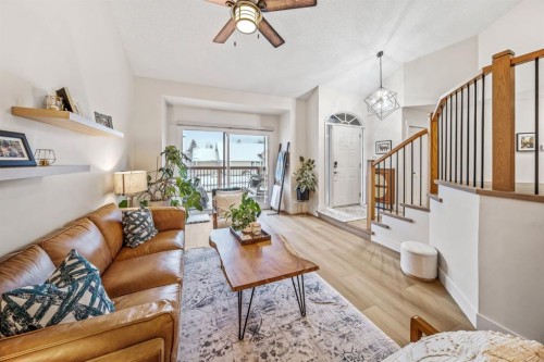 76 Stradbrooke Way Sw, Calgary, AB - Indoor Photo Showing Living Room