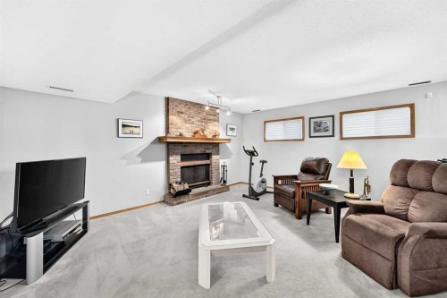 11444 Coventry Boulevard Ne, Calgary, AB - Indoor Photo Showing Living Room With Fireplace