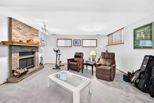 11444 Coventry Boulevard Ne, Calgary, AB - Indoor Photo Showing Living Room With Fireplace
