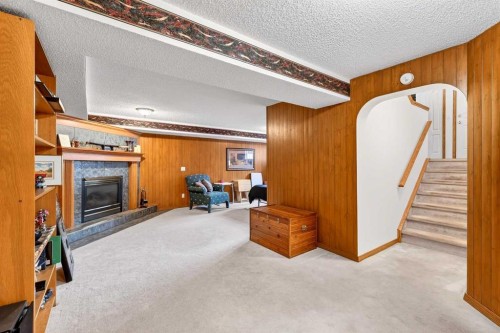 8 Somerset Gate Sw, Calgary, AB - Indoor With Fireplace