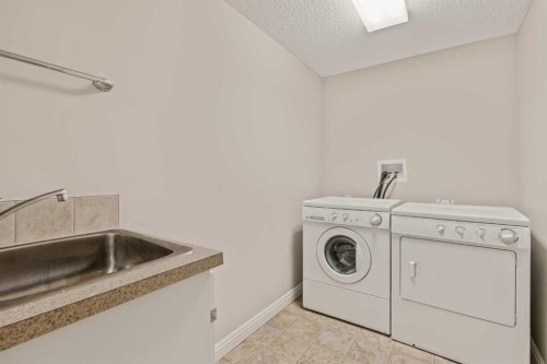 2964 Peacekeepers Way Sw, Calgary, AB - Indoor Photo Showing Laundry Room