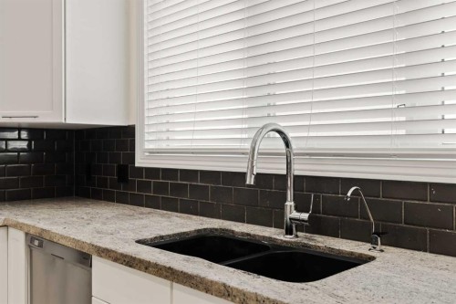 2964 Peacekeepers Way Sw, Calgary, AB - Indoor Photo Showing Kitchen With Double Sink