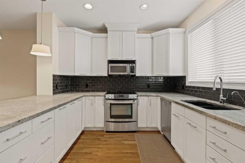 2964 Peacekeepers Way Sw, Calgary, AB - Indoor Photo Showing Kitchen With Double Sink With Upgraded Kitchen