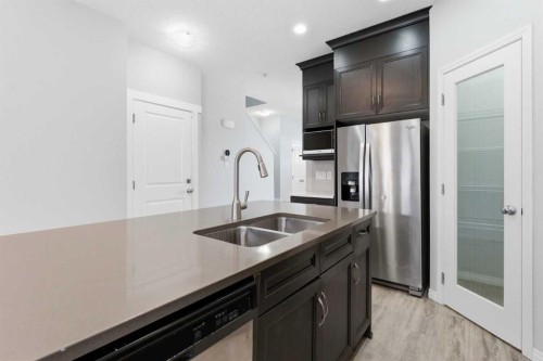 730 Redstone Drive Ne, Calgary, AB - Indoor Photo Showing Kitchen With Double Sink With Upgraded Kitchen