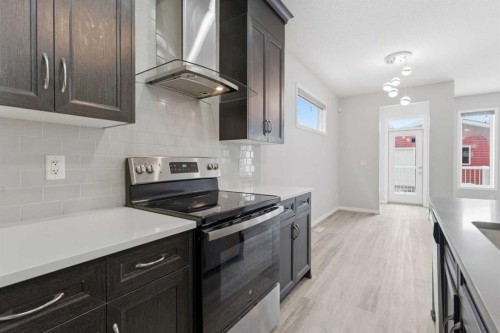 730 Redstone Drive Ne, Calgary, AB - Indoor Photo Showing Kitchen With Upgraded Kitchen