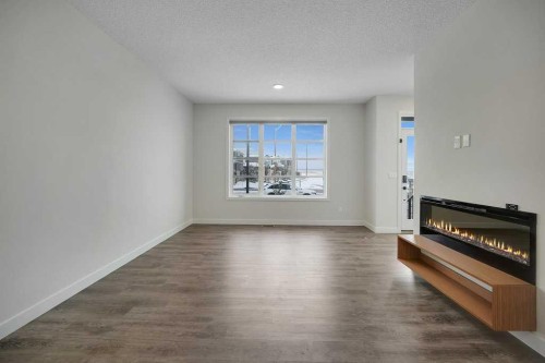 103 Highview Gate Se, Airdrie, AB - Indoor Photo Showing Living Room With Fireplace