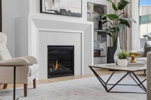 378 Bessborough Drive Sw, Calgary, AB - Indoor Photo Showing Living Room With Fireplace