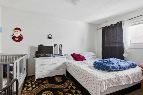 6131 Bowness Road Nw, Calgary, AB - Indoor Photo Showing Bedroom