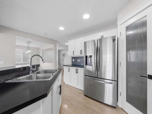 40 Everwillow Park Sw, Calgary, AB - Indoor Photo Showing Kitchen With Stainless Steel Kitchen With Double Sink