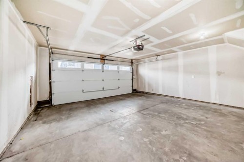 693 Savanna Boulevard Ne, Calgary, AB - Indoor Photo Showing Garage