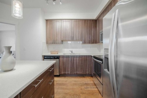 1216-215 Legacy Boulevard Se, Calgary, AB - Indoor Photo Showing Kitchen With Stainless Steel Kitchen With Upgraded Kitchen