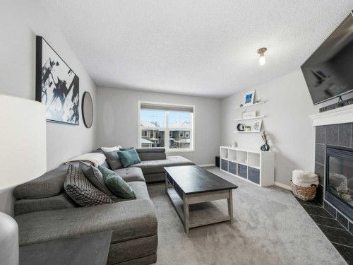 115 Canals Circle Sw, Airdrie, AB - Indoor Photo Showing Living Room With Fireplace