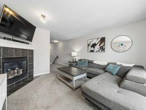 115 Canals Circle Sw, Airdrie, AB - Indoor Photo Showing Living Room With Fireplace