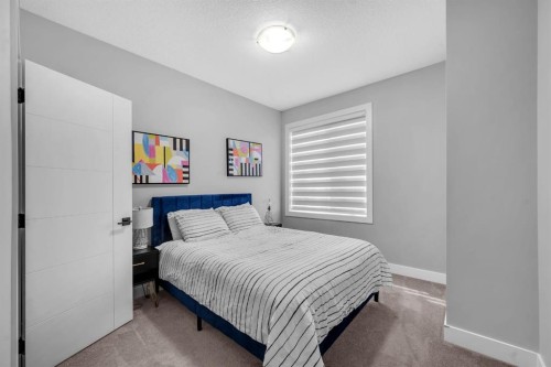 155 Carringham Way Nw, Calgary, AB - Indoor Photo Showing Bedroom