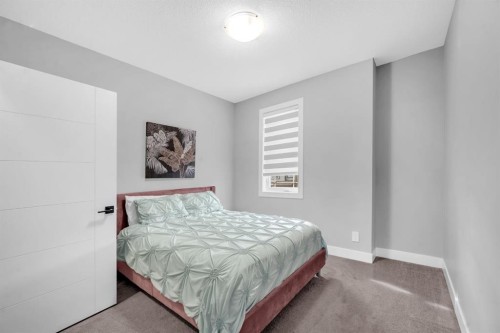155 Carringham Way Nw, Calgary, AB - Indoor Photo Showing Bedroom