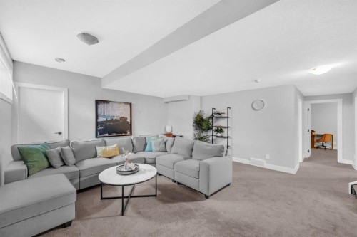 155 Carringham Way Nw, Calgary, AB - Indoor Photo Showing Living Room