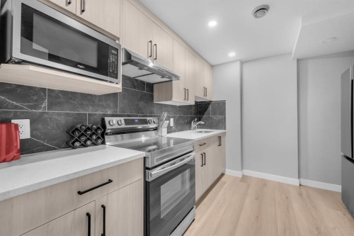 155 Carringham Way Nw, Calgary, AB - Indoor Photo Showing Kitchen